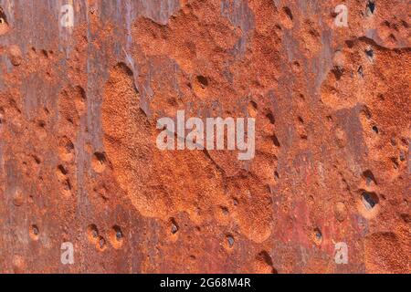 Abstract backgroundof close up pitted rusty metal surface Stock Photo