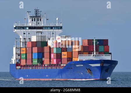 Containership EMOTION inbound Kiel Fjord, heading for the Kiel Canal, later on bound for Hamburg. Stock Photo