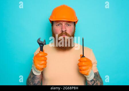 Incompetent worker is afraid and worried about his work Stock Photo
