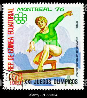 MOSCOW, RUSSIA - DECEMBER 16, 2020: Postage stamp printed in Equatorial Guinea shows Women's Gymnastics, Summer Olympics 1976, Montreal: Sports V seri Stock Photo