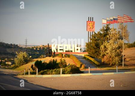 Kerch, Russia - 16 July 2017 entrance to the city of Kerch, letters, a plate with the inscription Kerch on the Tavrida highway in the steppe in summer Stock Photo
