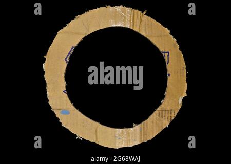 Beige and brown center hole cardboard paper detail, isolated on black background Stock Photo