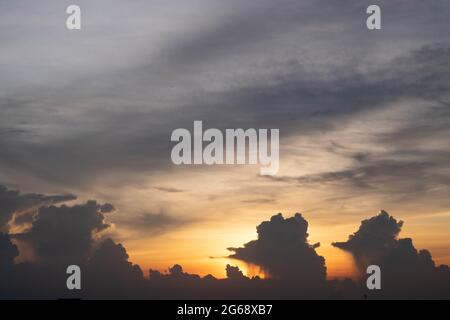 Giant dark cloud. Storm Clouds at Sunset before rain abstract weather environment season. Stock Photo