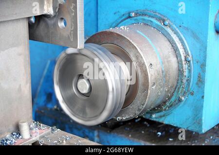 Metalworking process on a lathe. Frazing of metal structures. Industry. Stock Photo
