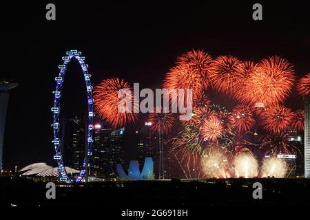 Sparkling firework around Singapore Flyer Stock Photo
