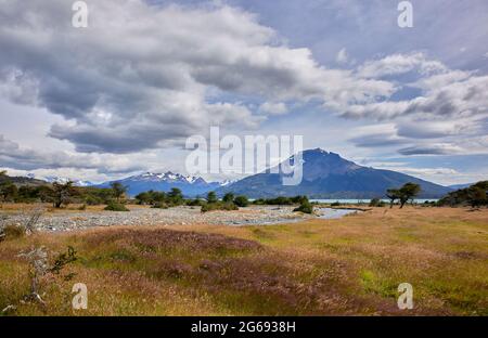 Panoramic view to the Torres Del Paine National Park from the remote Estancia La Peninsula ranch, Antonio Varas Peninsula, Natales, Patagonia, Chile Stock Photo