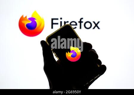 July 2, 2021, Barcelona, Catalonia, Spain: In this photo illustration, the Mozilla Firefox app seen displayed on a smartphone screen and a Mozilla Firefox logo in the background. (Credit Image: © Thiago Prudencio/DAX via ZUMA Wire) Stock Photo