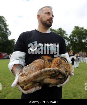 London, UK. 4th July, 2021. Animal rights activists hold dead, frozen animals outside Houses of Parliament in Annual Memorial Service for 'all the animals that died at the hands of humans. Credit: Tayfun Salci/ZUMA Wire/Alamy Live News Stock Photo