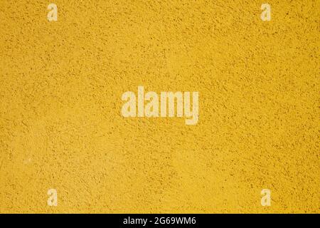 Yellow painted concrete wall texture or background Stock Photo