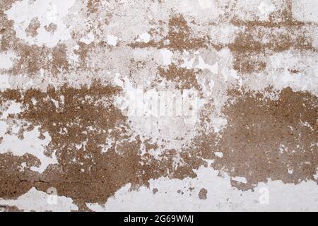 Old peeling whitewashed lime wall, grunge background or texture Stock Photo