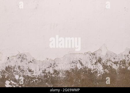 Old peeling whitewashed lime wall, white grunge background or texture Stock Photo