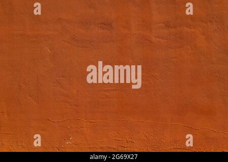 Terracotta color plastered wall texture Stock Photo