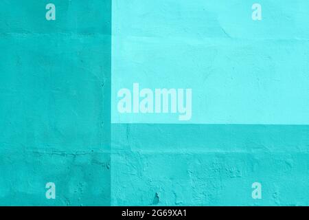 Turquoise painted plaster wall, geometric abstract background Stock Photo