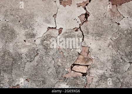 Old whitewashed cracked wall grunge background or texture Stock Photo