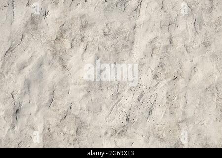 Old white painted limewashed plaster wall texture or background Stock Photo
