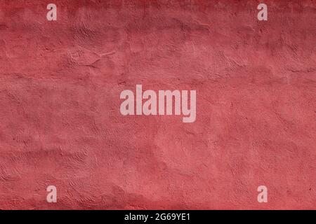 Red stucco finish plaser wall texture or background Stock Photo