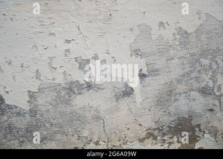 Old peeling whitewashed lime wall, white grunge background or texture Stock Photo