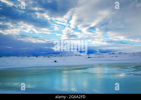 Interesting lighting at daybreak over the Námafjall region close to Hverfjall in northern Iceland during winter looking towards the Myvatnsoraefi mont Stock Photo