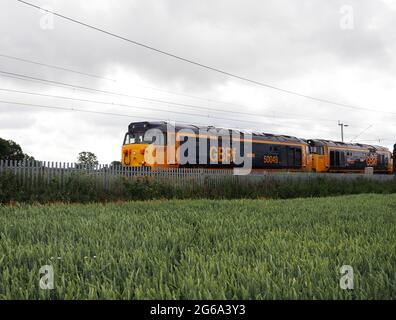 GBRF Class 50 locomotives 50049 'Defiance' and 50034 'Furious'/50007 'Hercules' on the West Coast Main Line near Northampton, UK Stock Photo