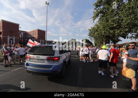 Rome, Italy. 3rd July, 2021. A police patrol vehicle passes amongst friendly rival fans on the streets outside the stadium prior to the during the UEFA Euro 2020 Quarter Final match at the Stadio Olimpico, Rome. Picture credit should read: Jonathan Moscrop/Sportimage Credit: Sportimage/Alamy Live News Stock Photo