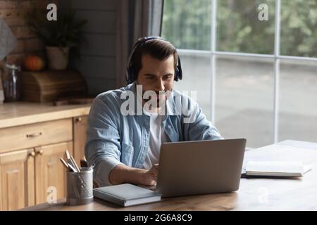 Happy adult student watching learning webinar, making video call Stock Photo