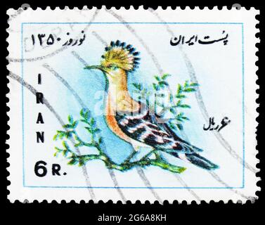 MOSCOW, RUSSIA - APRIL 18, 2020: Postage stamp printed in Iran shows Eurasian Hoopoe (Upupa epops), Iranian new year and first day of spring serie, ci Stock Photo