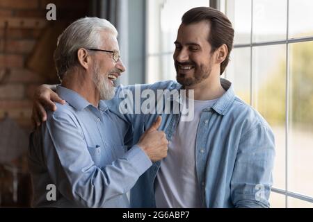 Happy proud mature older father expressing approval Stock Photo