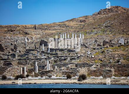 Delos the sacred Cycladic island Greece. There where archaeology meets history and mythology. Ruins of ancient civilization at seaside. Stonewalls mar Stock Photo