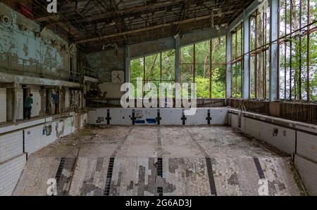 A picture of an old swimming pool in the town of Pripyat. Stock Photo