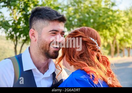 Man hugs his beloved woman smiling Stock Photo