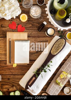 Homemade spa relax procedure and skin care. Natural skin care treatment. Eco friendly bathroom with organic cosmetics, spa accessories and notepad Stock Photo