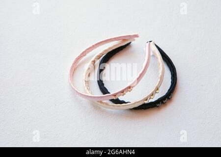 yellow, black and pink silk hair hoop isolated on white background. Flat lay Hairdressing tools and accessoriesas Color Hair Scrunchies, Orbital Hair Stock Photo
