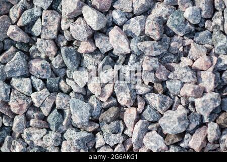 The texture of light gray granite gravel, used as a background Stock Photo