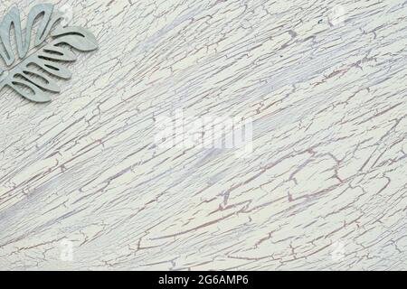 Floral leaf, wood decor. Flat lay on textured light mint green background. Copy-space, place for text on wooden board. Stock Photo