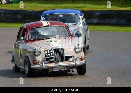 Riley one point five classic saloon, vintage racing car competing in the St Marys Trophy at the Goodwood Revival historic event, UK. Cars in chicane Stock Photo