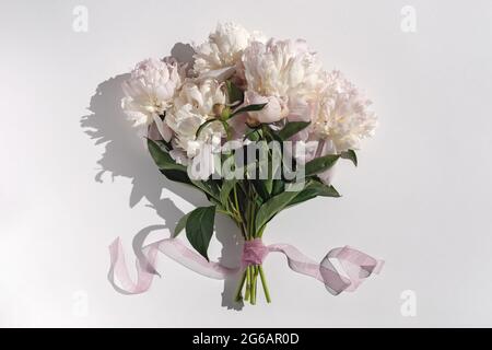Bunch of pink peonies on white background Stock Photo