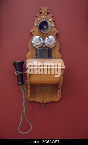 Vintage wall telephone on red background Stock Photo