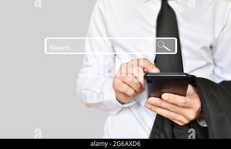 Businessman use smartphone for search page. Searching information data on internet networking. Stock Photo