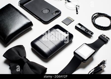 Black power bank and many black items for men. Close up at black power bank display. Stock Photo
