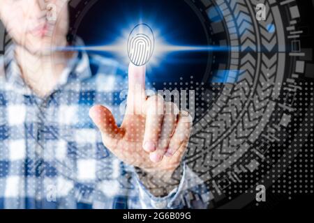 persons hand and 3d finger print hologram in front of him Stock Photo