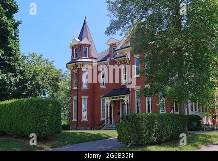 Elegant 19th century heritage house in a small town, with eleborate detailing in the porch enclosure Stock Photo