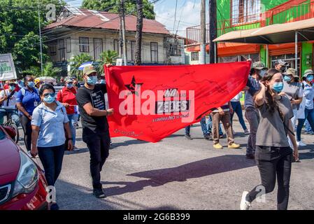 La Ceiba, Atlantida, Honduras. 31st May, 2021. Protesters hold an OFRANEH  (Black Fraternal Organization of Honduras) flag during the  demonstration.Protest against the proposed ZEDE (Zone of Employment and  Economic Development) that would