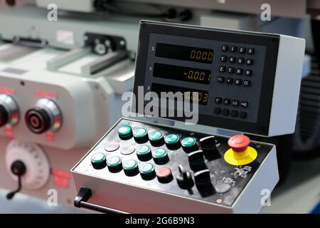 Lathe machine with remote control panel and 3 axis digital readout console. Selective focus. Stock Photo