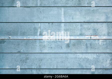 Gray blue wooden background with horizontal old planks and metal strip with nails Stock Photo