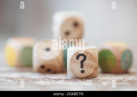 Close-up of wooden dice on a wooden table Stock Photo