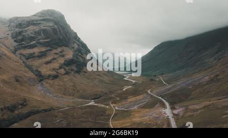 Aerial shot of Glen Coe, next to the Three Sisters of Glencoe. Absolutely stunning location on the famous A82 route through Scottish Highlands. Stock Photo