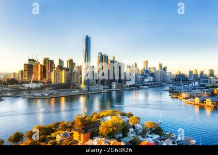 Sunrise over City of Sydney CBD high-rise towers around Darling Harbour - aerial view from Inner City suburbs. Stock Photo