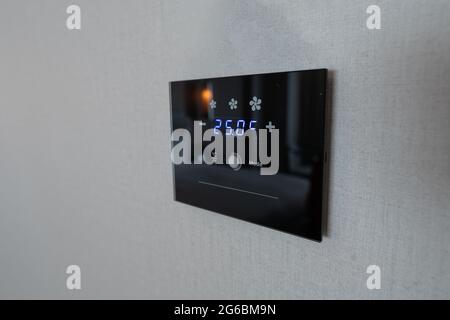 modern digital air condition panel on wall Stock Photo