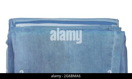 Jeans of various fabrics lie in a pile on a white background, isolate. Stock Photo