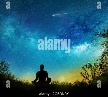 Yoga cosmic space meditation illustration, silhouette of man practicing  outdoors at night Stock Photo - Alamy